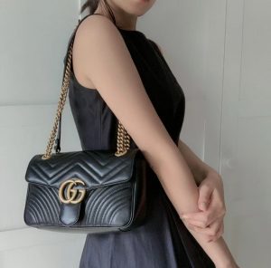minimal luxury outfit with leather handbag